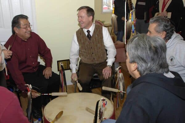Michael Bryant at a drumming circle at Kettle and Stony Point reserve with Sam George
